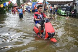 Apakah Aman Menerjang Banjir dengan Motor Listrik? Ini Penjelasannya
